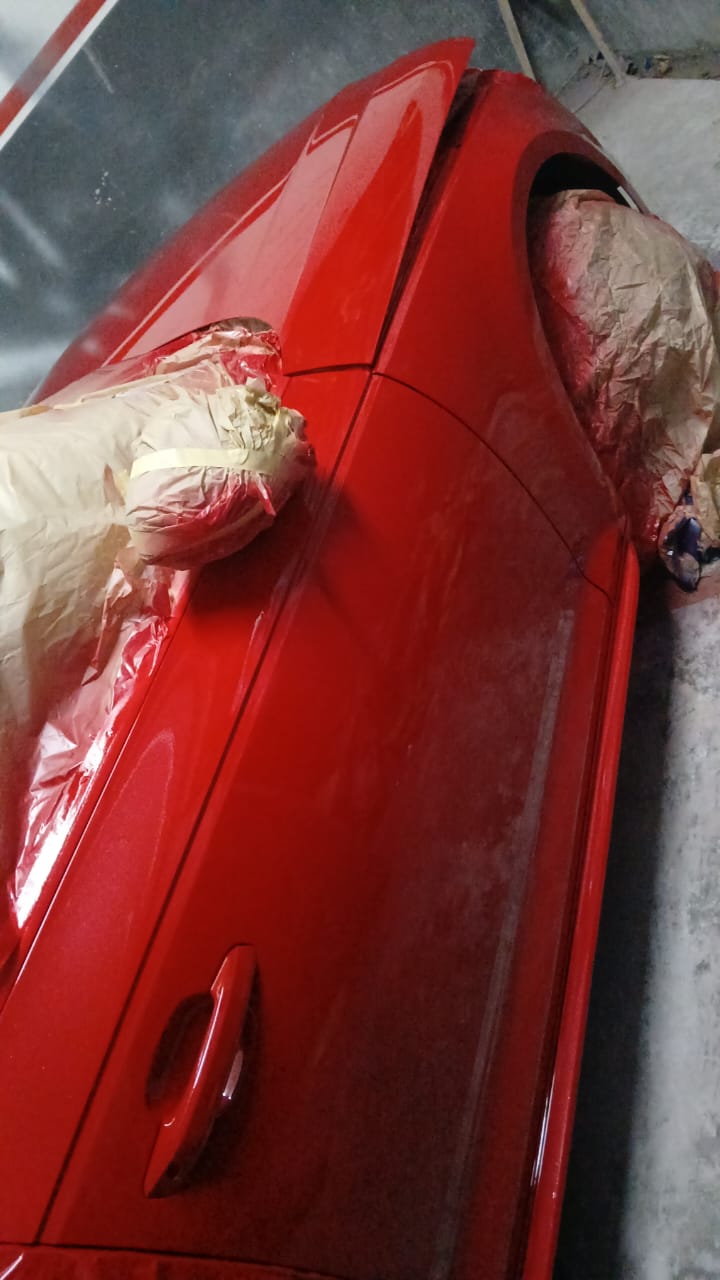 Bright red vehicle quarter panel with fresh gloss respray at Mega Body Auto Maitland